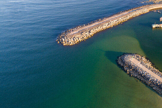 drone aerial view of a port harbor breakwater