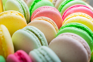 Close-up of macarons cakes of different colors. Culinary and cooking concept. Tasty colourful macaroons.