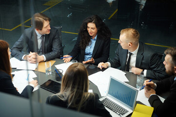 Business people discussing progress at meeting top view