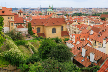 Fototapeta premium Roofs of houses and a view of the city of Prague. Background with selective focus and copy space