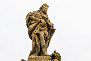 Fototapeta premium Ancient medieval sculptures on the Charles Bridge. Background with selective focus