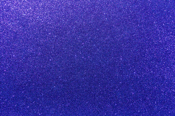 Background with sparkles. Backdrop with glitter. Shiny textured surface. Very dark blue