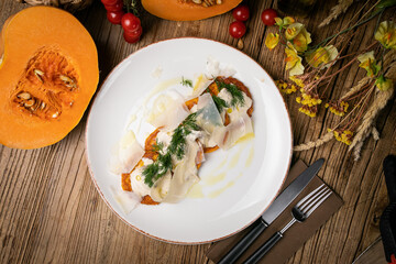 a pumpkin dish prepared by a chef in a restaurant
