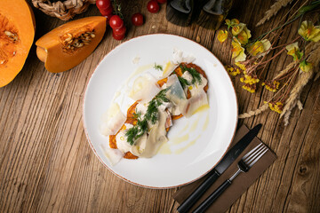 a pumpkin dish prepared by a chef in a restaurant
