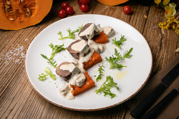 a pumpkin dish prepared by a chef in a restaurant
