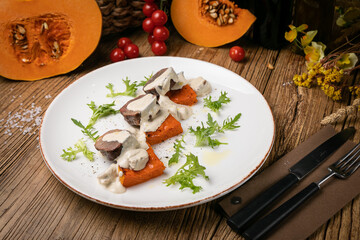 a pumpkin dish prepared by a chef in a restaurant

