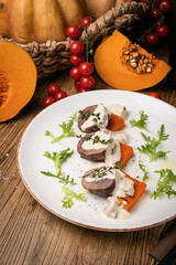 a pumpkin dish prepared by a chef in a restaurant

