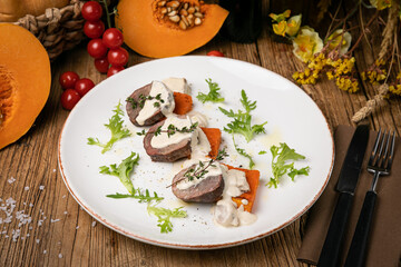 a pumpkin dish prepared by a chef in a restaurant
