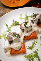 a pumpkin dish prepared by a chef in a restaurant
