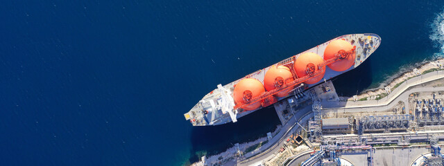 Aerial drone top down ultra wide panoramic photo of LNG (Liquified Natural Gas) tanker anchored in...