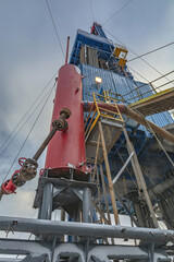 Drilling rig and drilling rig equipment for drilling oil and gas wells. Winter day. Snow lies on...