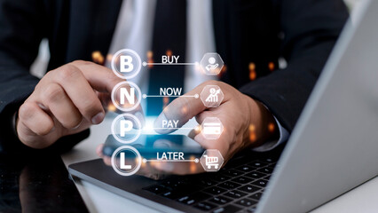 Businessmen holding a smartphone with icons of BNPL with online shopping icons technology. BNPL Buy now pay later online shopping concept.