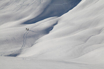 Two people on snowshoes at the Paradise area of Mt. Rainier National Park in Washington state in...