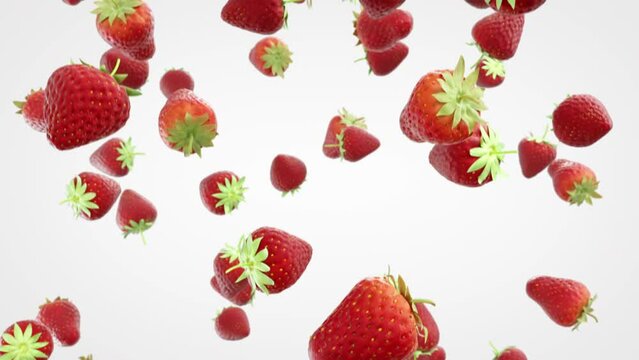 Strawberries falling down on white background. Group of spinning strawberries fall down in slow motion.