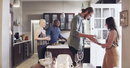 Friends, dinner and party with hello and celebration at house, group with hug and kiss for welcome and happy together. Men, women and food, friendship social time and celebrate birthday or holiday. - Powered by Adobe