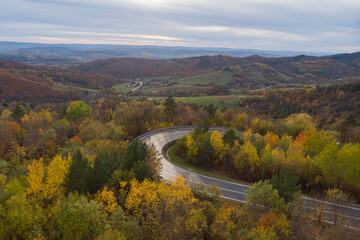Scenic autumn landscape of curvy road in Poland