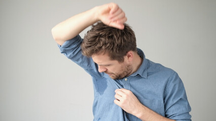 Sweaty spot on the shirt because of the heat, worries and diffidence
