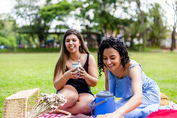 Two friends drinking tererê on a sunny afternoon.