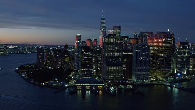 
Amazing view of the Big Apple at Dusk. High Quality Footage Shot from Helicopter over East River. Lower Manhattan New York City. United States. FDR Dr Full of Cars.