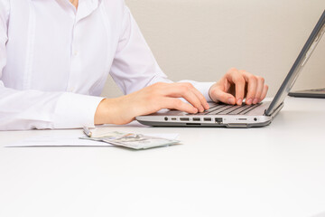 Image of male hands typing on a laptop. close-up. selective focus