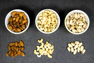 nuts (almonds, pistachio, cashews) in bowls