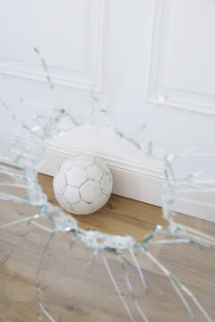 Soccer Ball and Broken Window