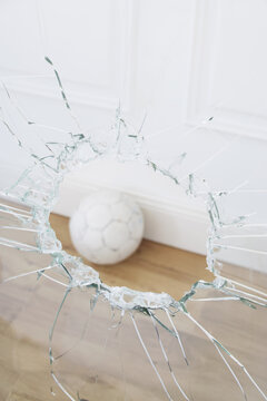 Soccer Ball and Broken Window
