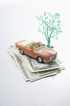 Toy Car and Dollars