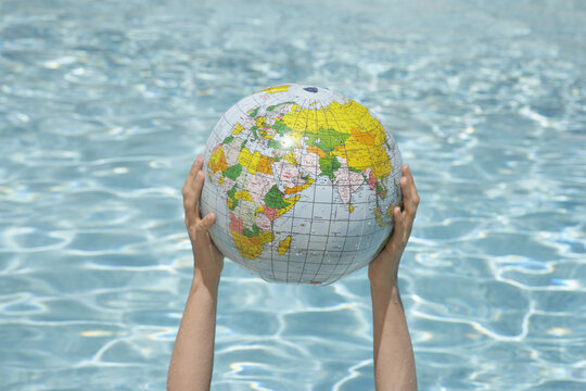 Woman Holding Inflatable Globe, Sanary-sur-Mer, Var, Provence, Provence-Alpes-Cote d'Azur, France