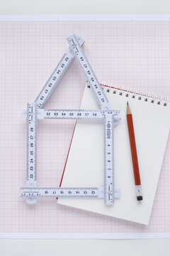 Folding Ruler in Shape of House with Pencil and Notepad
