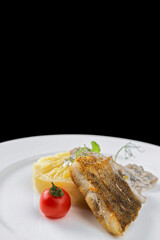 Fried pike perch fish with mashed potatoes and mushrooms in sauce