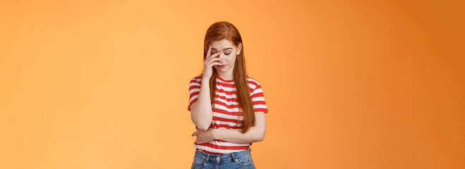 Annoyed redhead woman fed up listening stupid nonsense, close eyes tired, make face palm...