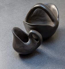 Ceramic jugs of dark material 