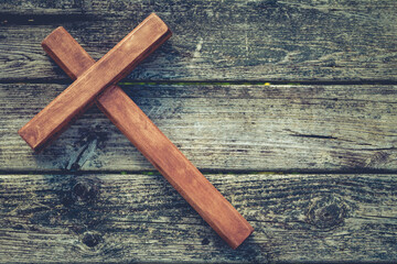Wooden cross on wood boards