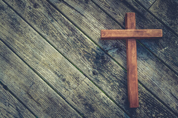 Wooden cross on wood boards