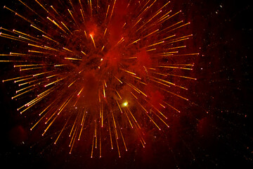 Fireworks in black sky. Explosions of pyrotechnics on holiday.