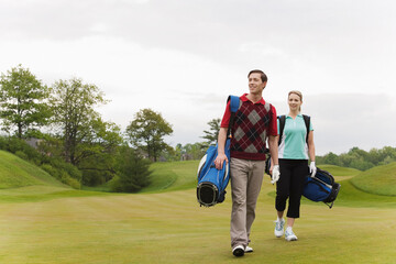 Couple Walking on Golf Course