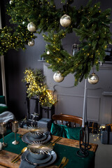 beautiful dark christmas interior with fake fireplace and armchair