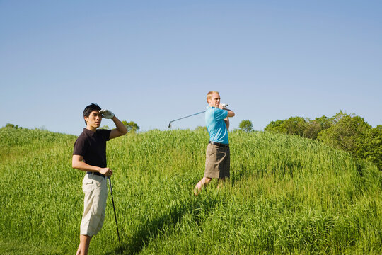 Men Playing Golf