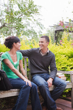 University Students Sitting Together on a Bench