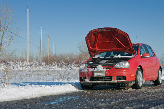 Car with Hood Up in Winter on Country Road