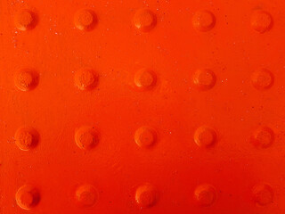 Red abstract background with convex dots.