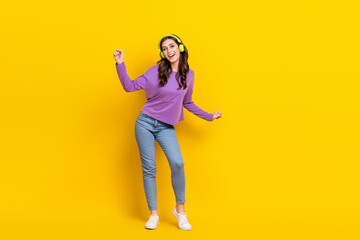 Fototapeta na wymiar Full body portrait of overjoyed cheerful lady have fun dancing listen new single isolated on yellow color background