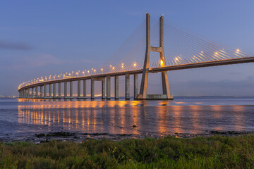 Landscape next to the Vasco of Gama bridge at blue hour in Lisbon, Portugal