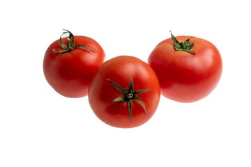 three red fresh tomatoes on a white background