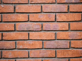 Old brown brick wall. Texture for design. Building material.