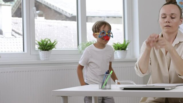 Young mother is working at laptop. Homeoffice