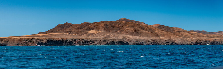 Fototapeta na wymiar Amazing view of volcanos from the sea in Lanzarote