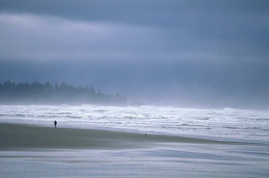 Person Running on Long Beach, Pacific Rim Nat. Park, Vancouver Island, B.C. Canada