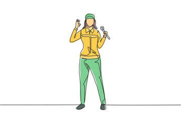 Single continuous line drawing female mechanic stands up with gesture okay and holding wrench to perform maintenance on vehicle engine. Success work. One line draw graphic design vector illustration